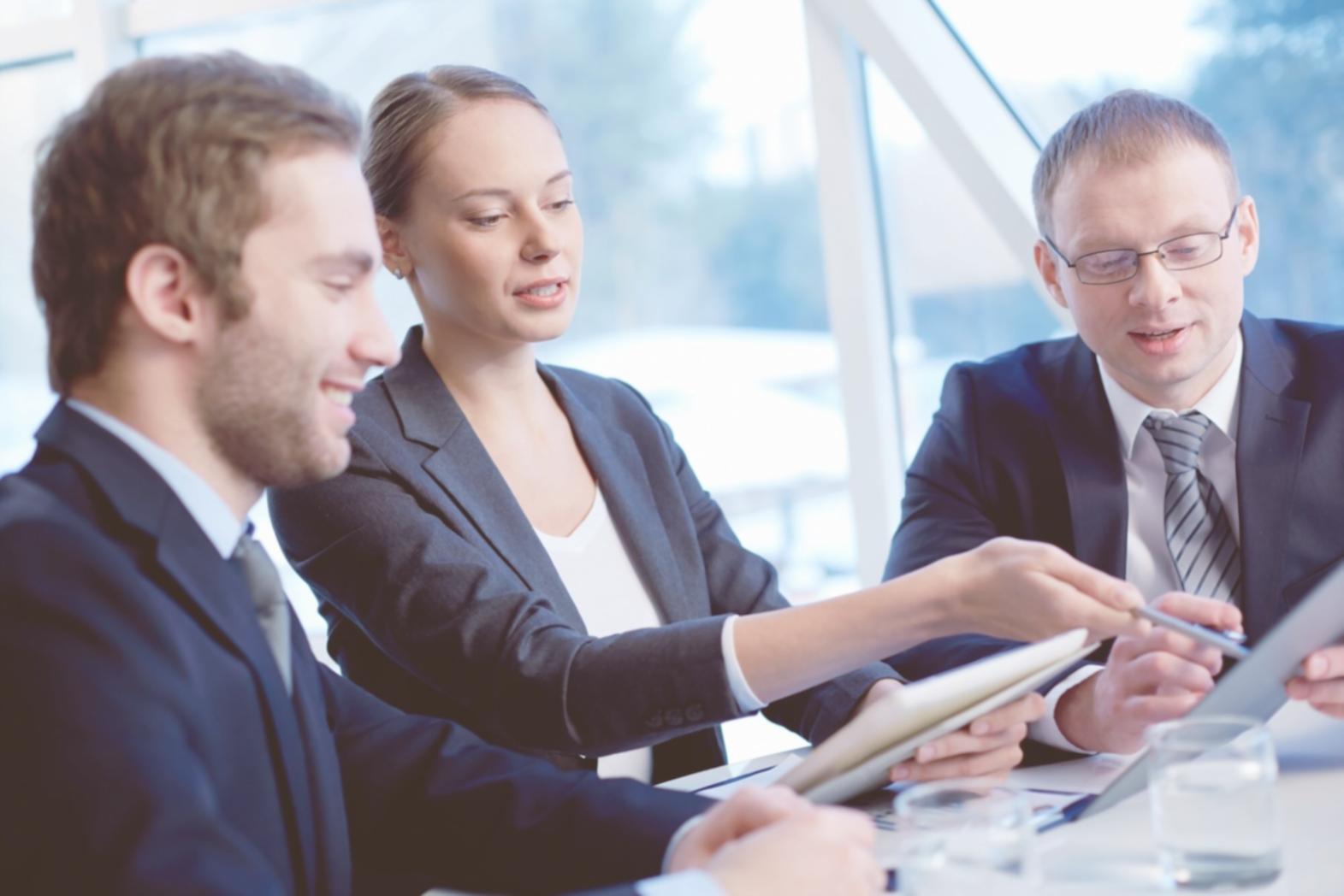 Professional finance team reviewing approval workflow systems